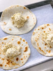 3 tortillas with a scoop of filling on each